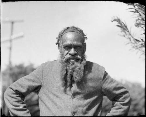 Bearded man with his hands on his hips, Alice Springs, Northern Territory, 1947, 2 [picture] / E.W. Searle