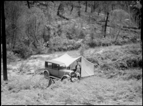 Mrs Searle in a tent and an Erskine car, Oxford Falls, Sydney, 1945 [picture] / E.W. Searle