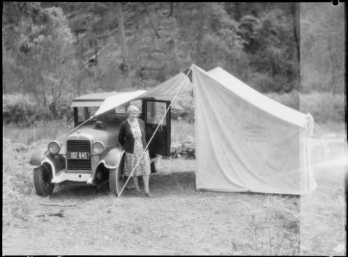 Mrs Searle beside a tent and an Erskine car, Oxford Falls, Sydney, 1945, 2 [picture] / E.W. Searle