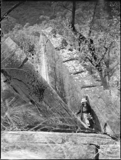 Mrs Searle beside a rock formation, Oxford Falls, Sydney, 1945 [picture] / E.W. Searle