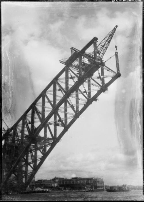 Southern end of Sydney Harbour Bridge arch under construction, Sydney Harbour, 1930, 1 [picture] / E.W. Searle