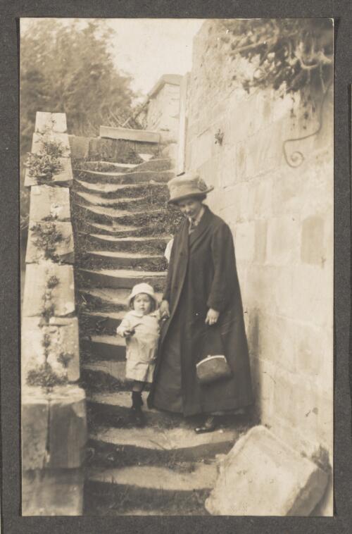 Mrs. Edward Searle and son Allan standing on the steps between Champ Street and the Penitentiary, Port Arthur [Tasmania], Easter 1913 [picture]