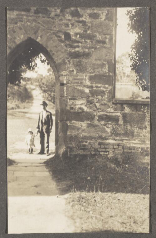 Edward W. Searle and son Allan at the entrance of the old church, Port Arthur [Tasmania], Easter 1913 [picture]