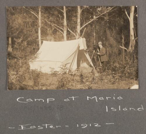 Edward Searle standing next to the camera during a camp at Maria Island, Easter 1912 [Tasmania] [picture]