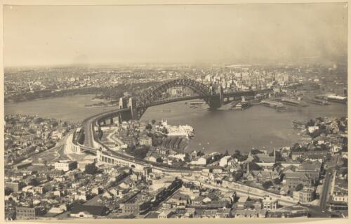 [Aerial view of Sydney Harbour Bridge and surrounds] [picture] / E. W. Searle