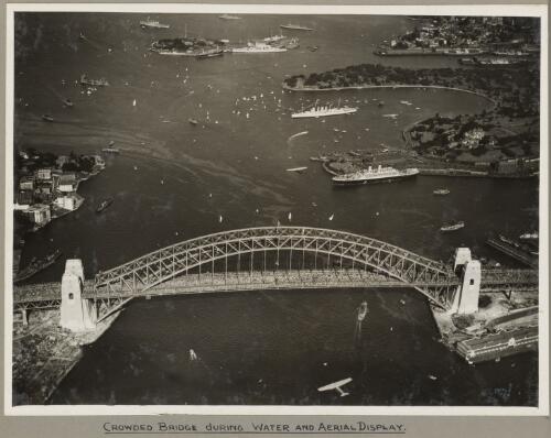 Sydney Harbour Bridge crowded with onlookers during the water and aerial display, 19 March 1932 [picture] / E. W. Searle