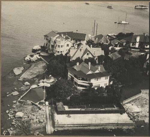 Aerial view of a mansion next to water, Sydney Harbour, ca. 1940 [picture] / E.W. Searle