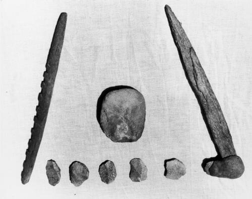 Close-up of hafted scraper, axe, wooden spear head, and other scrapers, all found in site #2, Oenpelli Hill, Oenpelli, October, 1948 [picture] / Frank M. Setzler