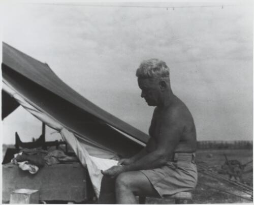 Bill Harney reading one of his poems, Oenpelli, Northern Territory, 1948 [picture] / Frank M. Setzler