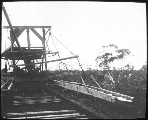 Track-laying machine being used on the Trans-Australian railway construction between Port Augusta and Kalgoorlie, ca. 1915, 1 [transparency] : a deputation lantern slide of the AIM [Australian Inland Mission] Head Office / John Flynn[?]