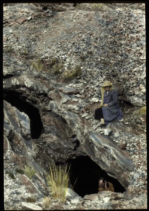 Unidentified man and women looking at a rock formation [transparency] : a deputation lantern slide of the AIM [Australian Inland Mission] Head Office, 1926-1940 / [John Flynn?]