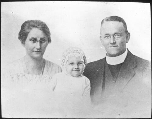 Our representatives at Carnarvon, Rev. John Waugh with wife and child [transparency] : a deputation lantern slide of the AIM [Australian Inland Mission] Head Office, 1926-1940 / [John Flynn?]