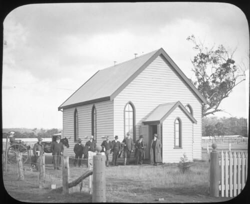 Unidentified church with men standing outside and a woman sitting in a carriage [transparency] : miscellaneous glass slide / [John Flynn?]