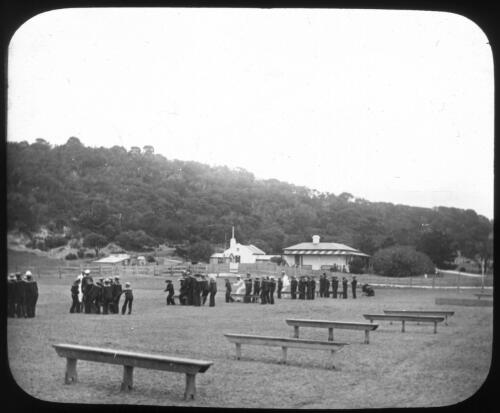 Unidentified Australian naval officers with buildings in background [transparency] : miscellaneous glass slide / [John Flynn?]