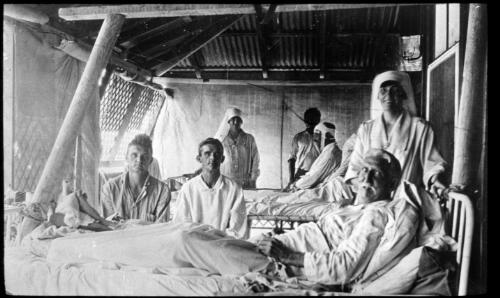 Patients in hospital ward, Port Hedland [transparency] : taken on survey trip undertaken in 1927 by Rev. J.A. Barber and Dr. George Simpson for the Flying Doctor Scheme
