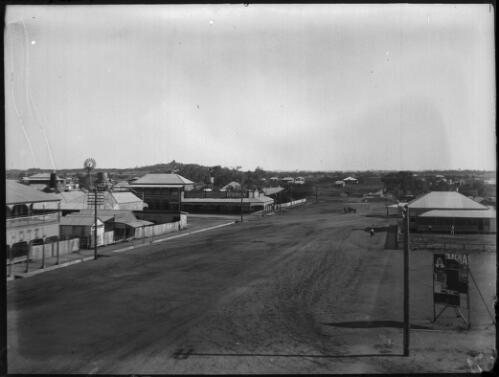 Street scene showing various businesses [picture] : Fred McKay Cape York Peninsula and West Queensland Patrol 1938-1940 / [Fred McKay]