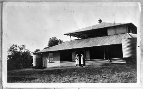 Two unidentified nurses standing in the doorway of an unidentifed building [picture] : Cape York Peninsula and West Queensland Patrol areas, Fred McKay Patrol 1938-1940 / [Fred McKay]