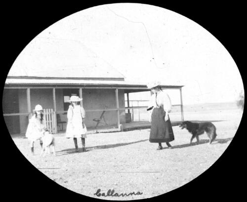 Three unidentified young women outside Callanna Homestead, South Australia [transparency] : lantern slide used by Rev. F.H. Paterson, north South Australia / [John Flynn?]
