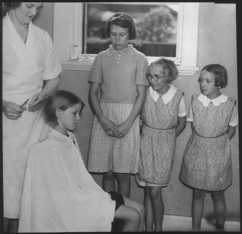 Girls waiting to have their hair cut, South Australia [transparency] : scene of mid-north South Australia used by Rev. F.H. Patterson on Stuart Patrol 1930+