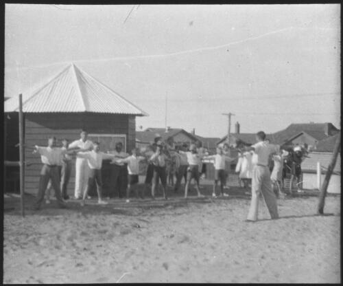Group of children exercising, South Australia [transparency] : scene of mid-north South Australia used by Rev. F.H. Patterson on Stuart Patrol 1930+