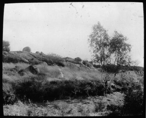 Devil's Marbles, near Central Mount Stuart, Northern Territory [transparency] : a deputation slide of the AIM [Australian Inland Mission] Head Office, 1926-1940/ [John Flynn?]