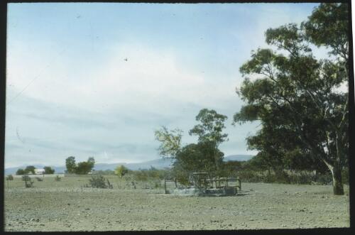 Grave [dry field with a well or mine shaft] [transparency] : a deputation slide of the AIM [Australian Inland Mission] Head Office, 1926-1940/ [John Flynn?]