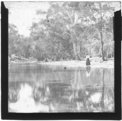 Unidentified woman standing by a river? [transparency] : part of South Australian and other AIM [Australian Inland Mission] scenes used by Rev. F.H. Patterson