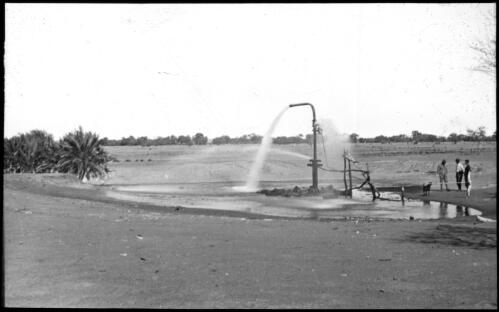 Artesian bore, shows water squirting out of nozzle [transparency] : a lantern slide used in lectures on all Australian Inland Mission activities, 1940- / [John Flynn?]
