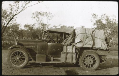 To A.S.I. super's car, sisters Small and Pope [picture of a heavily laden car in the bush] [transparency] : part of scenes of the Northern Territory and North Western Australia / [John Flynn?]