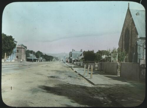 Street with a church in an unidentified town [transparency] : part of South Australian and other AIM [Australian Inland Mission] scenes used by Rev. F.H. Patterson
