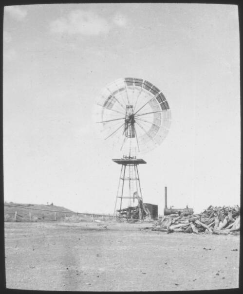 Windmill on Alexandria Station, Barkly Tableland region, Northern Territory [transparency] / [John Flynn?]