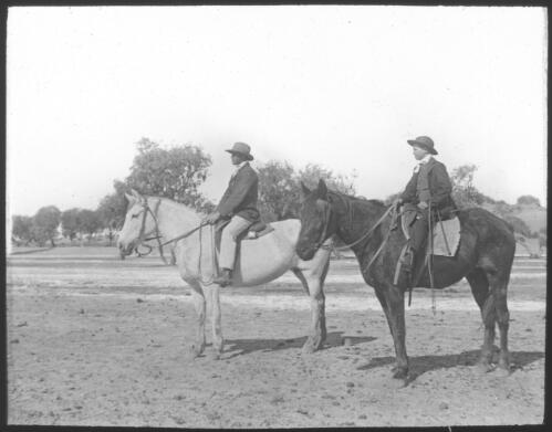 Two unidentified men on horses, [2] [transparency] / [John Flynn?]