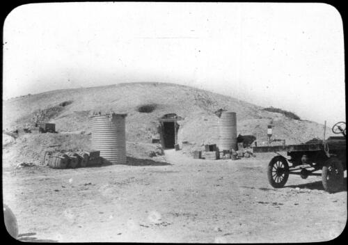 Mining site with a truck [transparency] : inland people and general scenes / [John Flynn?]