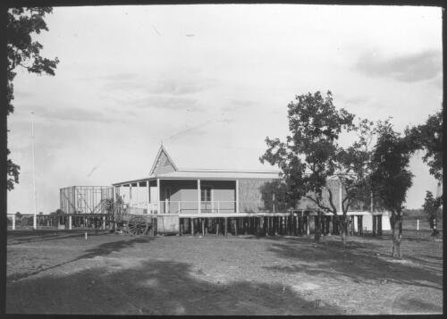 Unidentified corrugated iron building with wide veranda raised above ground [transparency] / [John Flynn?]