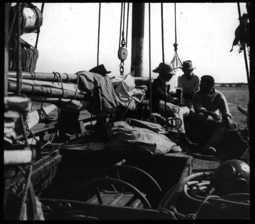 Fishermen on deck of a lugger [transparency] : a lantern slide used by John Flynn in lectures / [John Flynn]