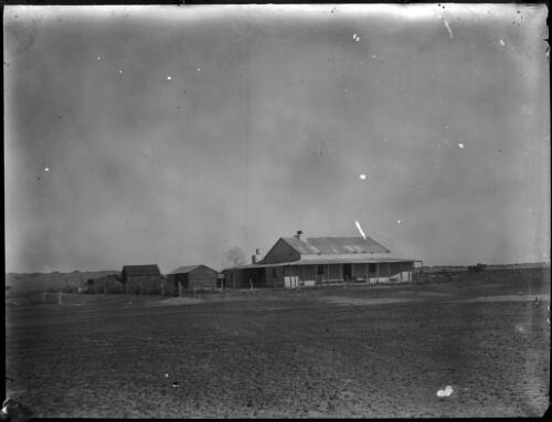 Unidentified building from a distance [picture] : an image used by the Australian Inland Mission at Dunbar, Cape York / [John Flynn?]