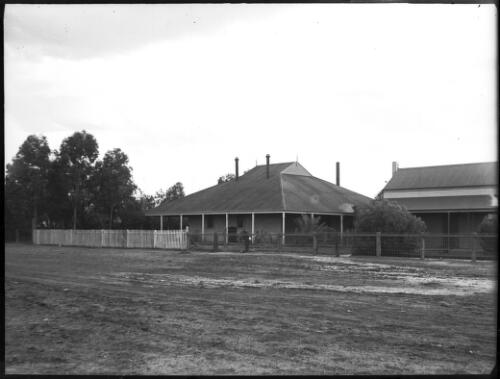 House with fence [picture] : an image used by the Australian Inland Mission at Dunbar, Cape York / [John Flynn?]