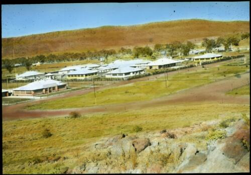 View of hospital buildings at distance, Alice Springs [transparency] : a lantern slide used in lectures on all Australian Inland Mission activities / [John Flynn?]