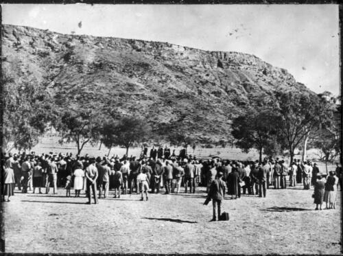 Large group of people gathered for a ceremony [transparency] : a lantern slide used in lectures on all Australian Inland Mission activities / [John Flynn?]