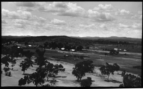 Unidentified small town in hills [transparency] : part of scenes of the Northern Territory and North Western Australia / [John Flynn?]