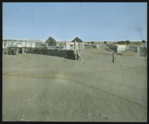 Unidentified abandoned dwellings in desert [transparency] / [John Flynn?]