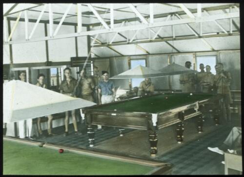 Men playing billiards at the Inter-Church Club, Darwin [transparency] : a lantern slide used in lectures on all Australian Inland Mission activities / [John Flynn?]