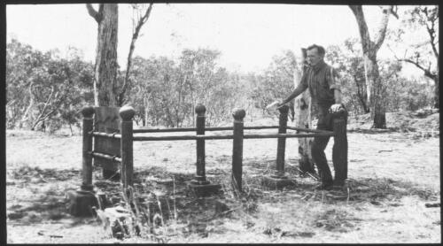 Unidentified man standing next to Fizzer's grave [transparency] : a lantern slide used in lectures on all Australian Inland Mission activities / [John Flynn?]
