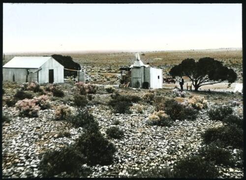 T. Hut [Unidentified view of buildings in a desert landscape] [transparency] : a lantern slide used by John Flynn in lectures / [John Flynn]
