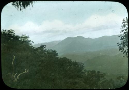View of landscape with mountains in the background [from Turnback] [transparency] : a lantern slide from John Flynn's missionary days in Gippsland 1906-7 / John Flynn