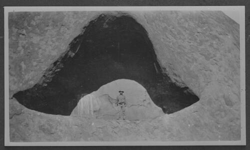 Unidentified man at the mouth of a cave [picture] / [John Flynn?]