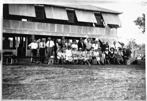 Group portrait outside the Dunbar first aid and welfare outpost [1] [picture] : part of scenes of the Dunbar opening, Fred McKay patrol 1938 / [John Flynn?]