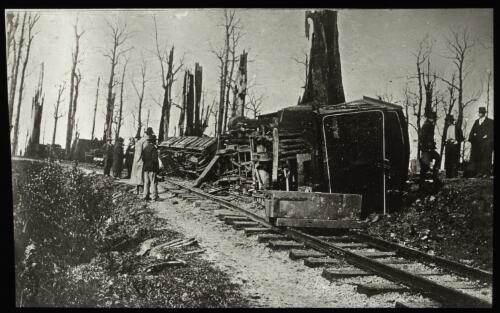Derailed train locomotive No. 3A and freight cars on the narrow gauge Beech Forest line, Victoria, 5 October 1904 [transparency] / [John Flynn?]