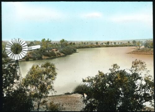 Windmill next to an unidentified river [2] [transparency] : part of a lantern slide lecture collection, 1926 / [John Flynn?]