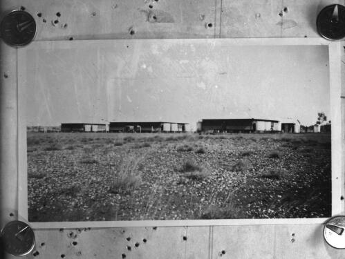 Unidentified buildings in outback location [picture] : scenes of the Birdsville area / [John Flynn?]